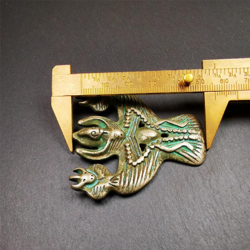 This Garuda is collected from Yaqing Monastery Baiyu County Tibet,it's a handmade badge,amulet pandent, made of copper,about 80 years old. You can wear it as amulet pendant, or make it into wall decoration, hang on the door as a protector,or just put it on your desk,as an ornament.