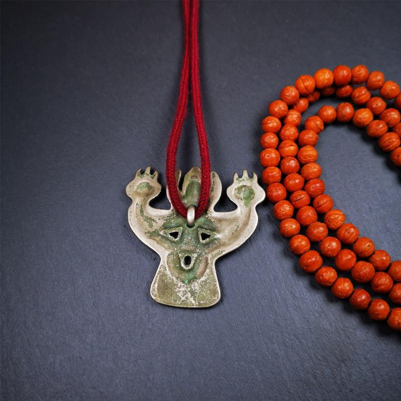This Garuda is collected from Yaqing Monastery Baiyu County Tibet,it's a handmade badge,amulet pandent, made of copper,about 80 years old. You can wear it as amulet pendant, or make it into wall decoration, hang on the door as a protector,or just put it on your desk,as an ornament.