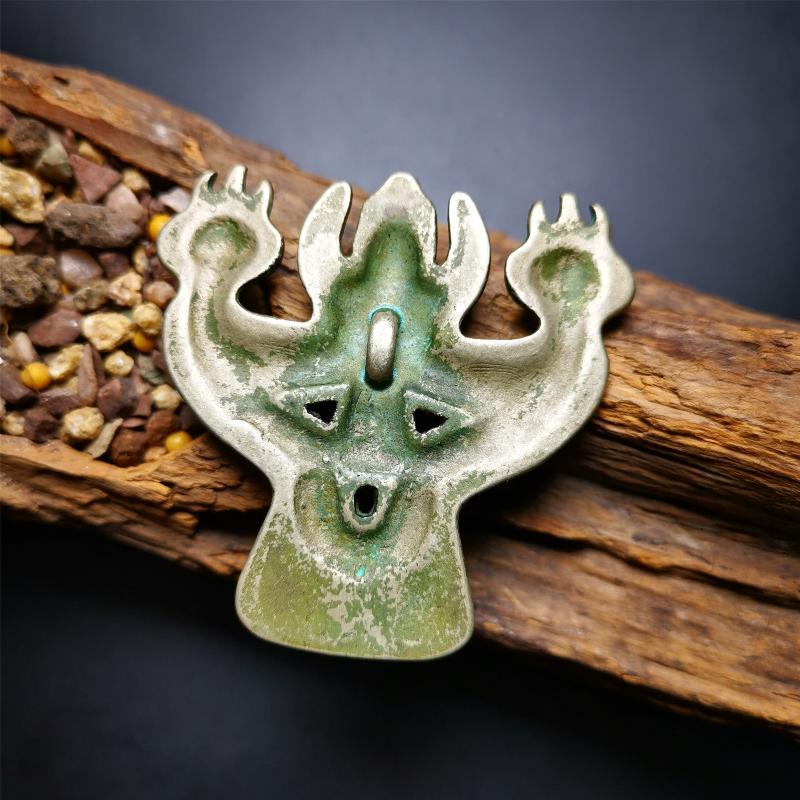 This Garuda is collected from Yaqing Monastery Baiyu County Tibet,it's a handmade badge,amulet pandent, made of copper,about 80 years old. You can wear it as amulet pendant, or make it into wall decoration, hang on the door as a protector,or just put it on your desk,as an ornament.