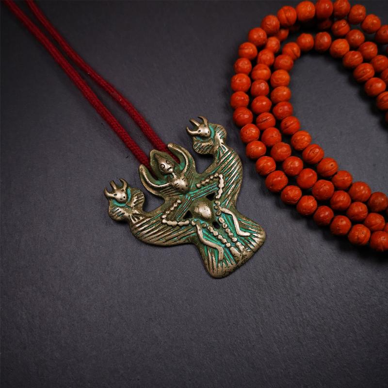 This Garuda is collected from Yaqing Monastery Baiyu County Tibet,it's a handmade badge,amulet pandent, made of copper,about 80 years old. You can wear it as amulet pendant, or make it into wall decoration, hang on the door as a protector,or just put it on your desk,as an ornament.