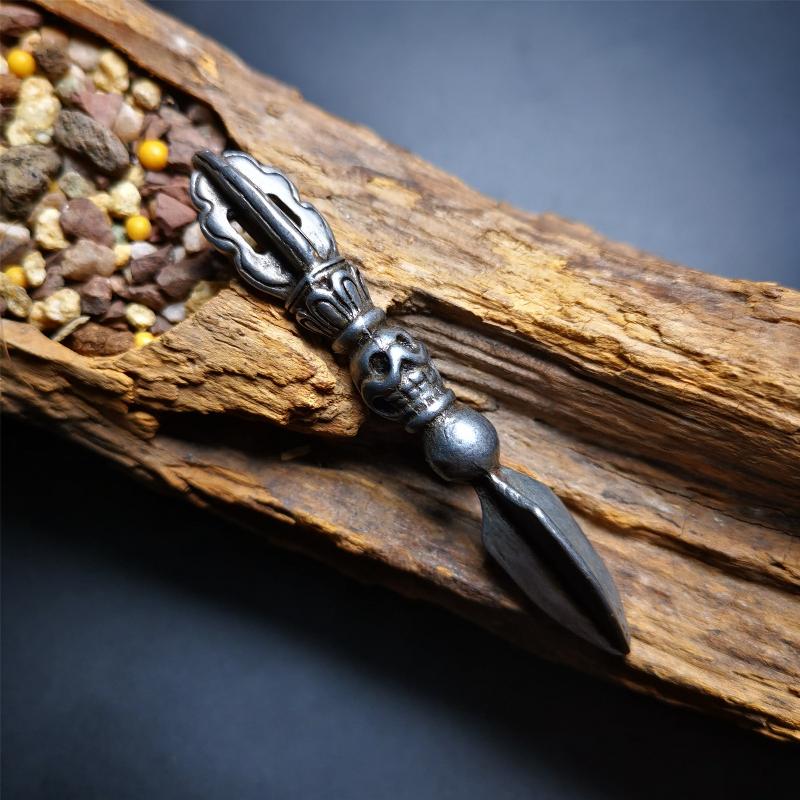 This phurba amulet was made of cold iron by Tibetan craftsmen in 1990's,its upper part is a vajra,and carved Shmashana Adhipati skull in the middle, the lower part is a Dorje Phurba,length is 3.0inches