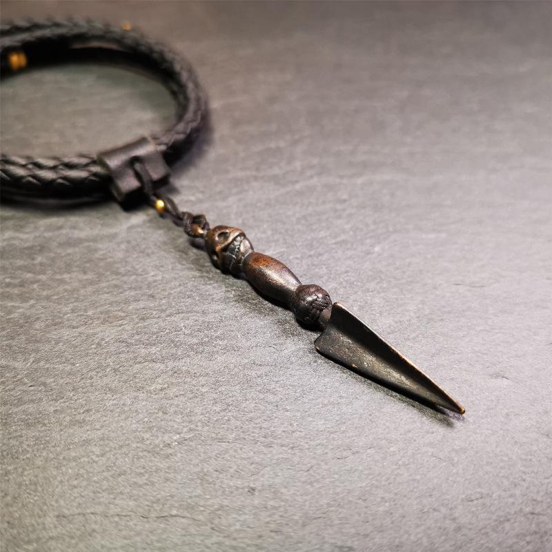 This phurba was made by Tibetan craftsmen and come from Hepo Town, Baiyu County, the birthplace of the famous Tibetan handicrafts. It is black color and 2.48" length,the upper part is Shmashana Adhipati skull, the lower part is a Dorje Phurba.