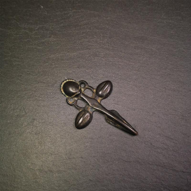 This beautiful phurba pendant is hand carved by Tibetan craftsmen from Tibet in 1960's. It is made of thokcha,full of black color,the upper part is a horizontal vajra, and the lower part is a phurba,size is 2.6 by 1.7 inches