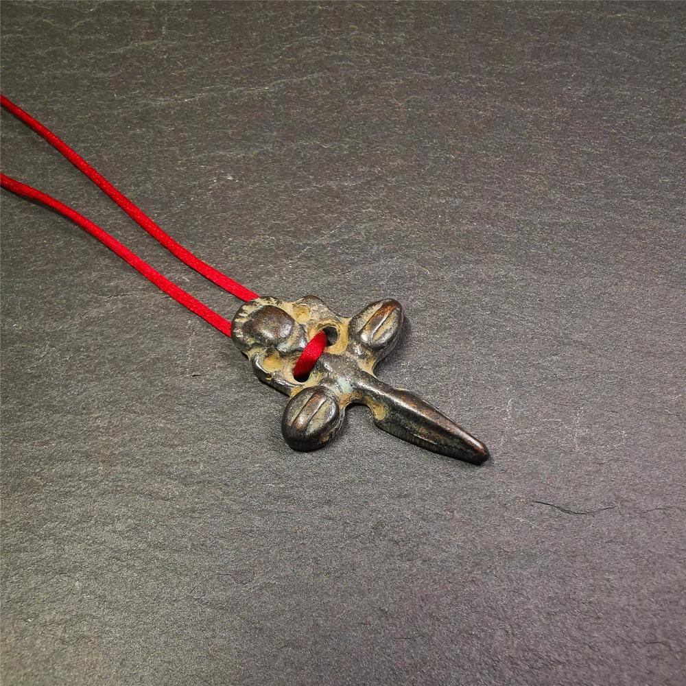 Gandhanra Tibetan Buddhist Ritual Implement - Kila -Dorje Phurba amulet pendant,a cross vajra in the middle,made of thokcha,black color, length about 1.57", handmade by Tibetan craftsmen from Tibet in 1960's.