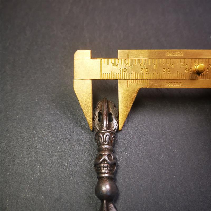 This phurba amulet was made of cold iron by Tibetan craftsmen in 1990's,its upper part is a vajra,and carved Shmashana Adhipati skull in the middle, the lower part is a Dorje Phurba,length is 3.0inches