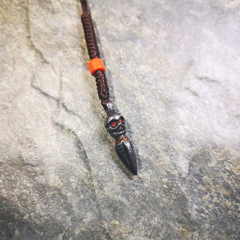 This phurba was made by Tibetan craftsmen.Its upper part is Shmashana Adhipati skull, it's eyes are embedded with agate beads,the lower part is a Dorje Phurba,and a copper wire inlaid on the waist of the phurba, very delicate.