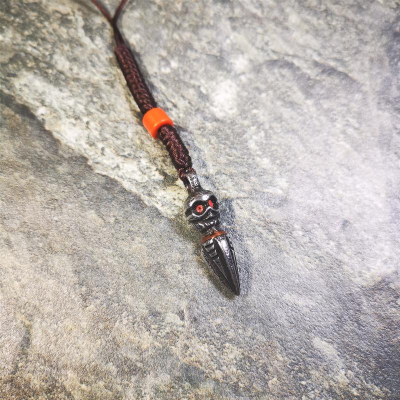 This phurba was made by Tibetan craftsmen.Its upper part is Shmashana Adhipati skull, it's eyes are embedded with agate beads,the lower part is a Dorje Phurba,and a copper wire inlaid on the waist of the phurba, very delicate.