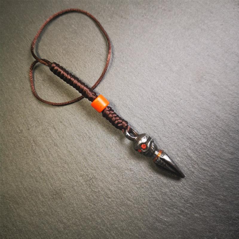 This phurba was made by Tibetan craftsmen.Its upper part is Shmashana Adhipati skull, it's eyes are embedded with agate beads,the lower part is a Dorje Phurba,and a copper wire inlaid on the waist of the phurba, very delicate.