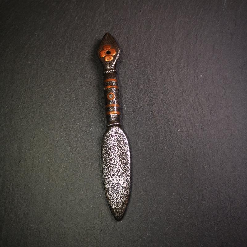 This kila / phurba was handmade by Tibetan craftsmen from Tibet in 2000s. It's a kila dagger,made of cold iron, carved cloud pattern, inlaid red copper, made into a dzi pattern on handle, and the petals of the tail hanging ring