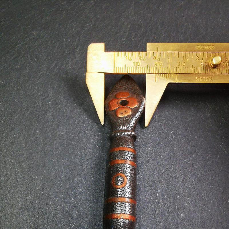 This kila / phurba was handmade by Tibetan craftsmen from Tibet in 2000s. It's a kila dagger,made of cold iron, carved cloud pattern, inlaid red copper, made into a dzi pattern on handle, and the petals of the tail hanging ring
