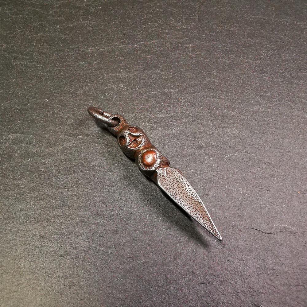 This phurba was made by Tibetan craftsmen and come from Hepo Town, Baiyu County,Tibet. Its upper part is Shmashana Adhipati skull, the lower part is a Dorje Phurba,and a copper dot inlaid on the waist of the phurba