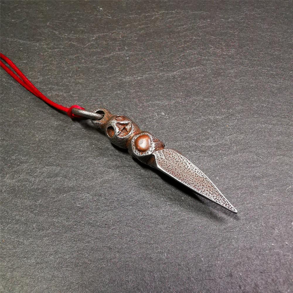 This phurba was made by Tibetan craftsmen and come from Hepo Town, Baiyu County,Tibet. Its upper part is Shmashana Adhipati skull, the lower part is a Dorje Phurba,and a copper dot inlaid on the waist of the phurba