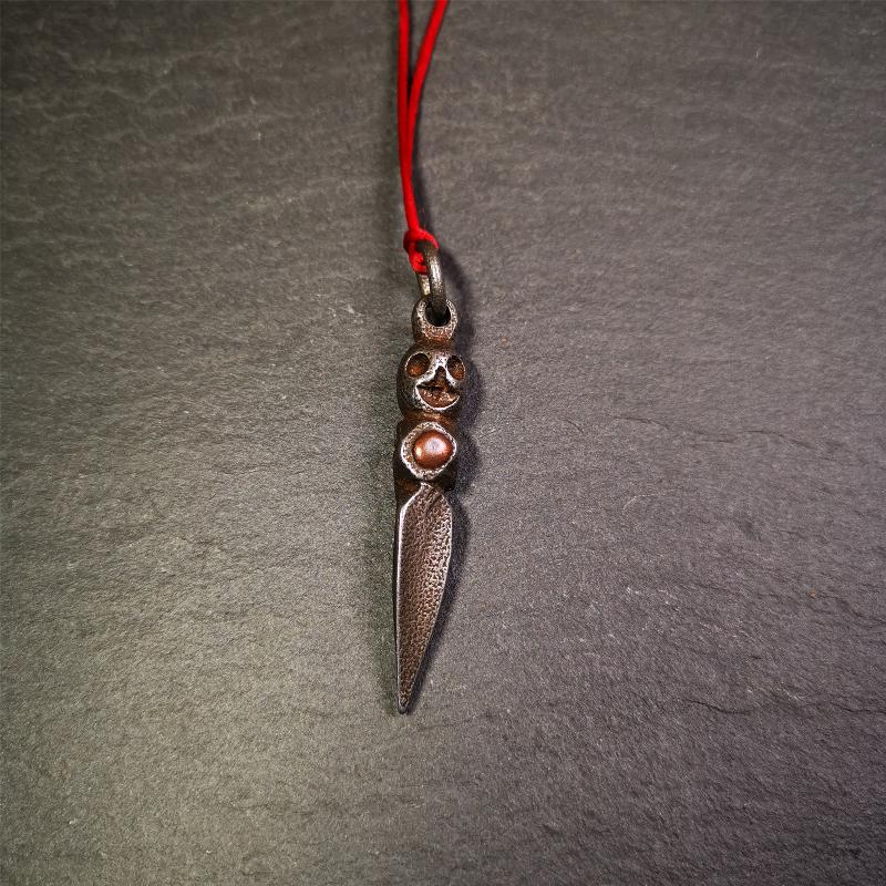 This phurba was made by Tibetan craftsmen and come from Hepo Town, Baiyu County,Tibet. Its upper part is Shmashana Adhipati skull, the lower part is a Dorje Phurba,and a copper dot inlaid on the waist of the phurba