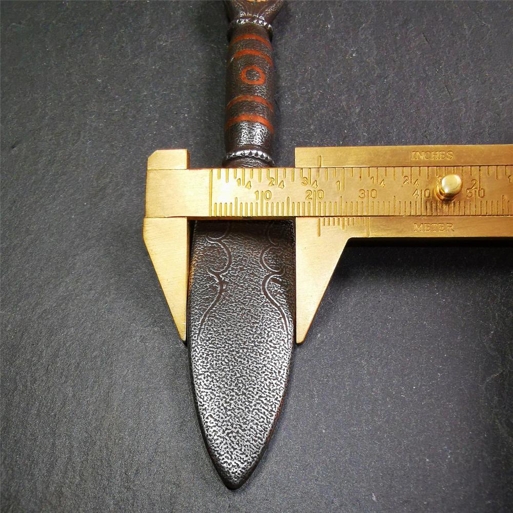 This kila / phurba was handmade by Tibetan craftsmen from Tibet in 2000s. It's a kila dagger,made of cold iron, carved cloud pattern, inlaid red copper, made into a dzi pattern on handle, and the petals of the tail hanging ring