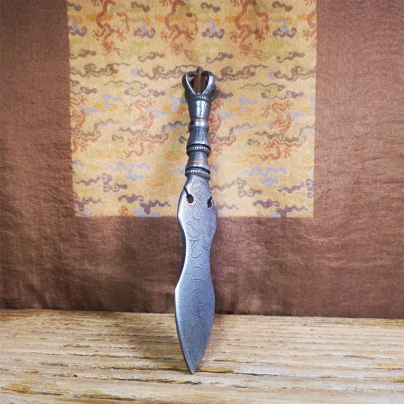 This phurba kila is handmade by Tibetan craftsmen from Tibet in 2000's,from Hepo Town, Baiyu County, the birthplace of the famous Tibetan handicrafts.  It's a kila dagger,made of cold iron, carved cloud pattern, inlaid red copper, and the half vajra on the handle,very delicate.
