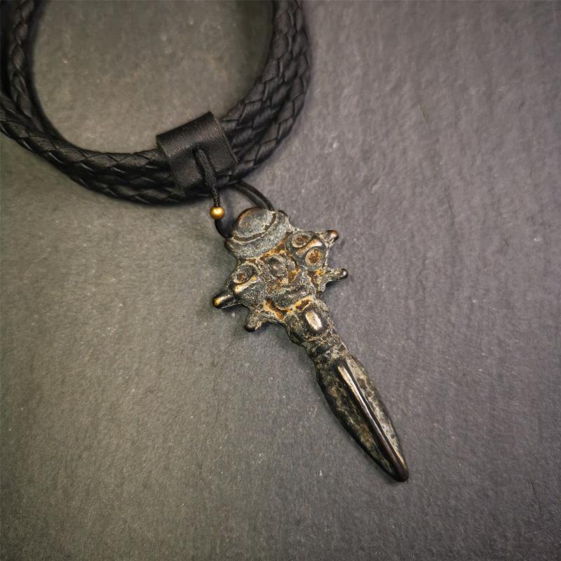 This beautiful phurba pendant was collected in Rejia Monastery,Baiyu,Tibet,about 70 years old.It was blessed by lama. It's made of thokcha, whole body is blcak,at the top is a mani jewel and horizontal vajra, the bottom is a vertical phurba