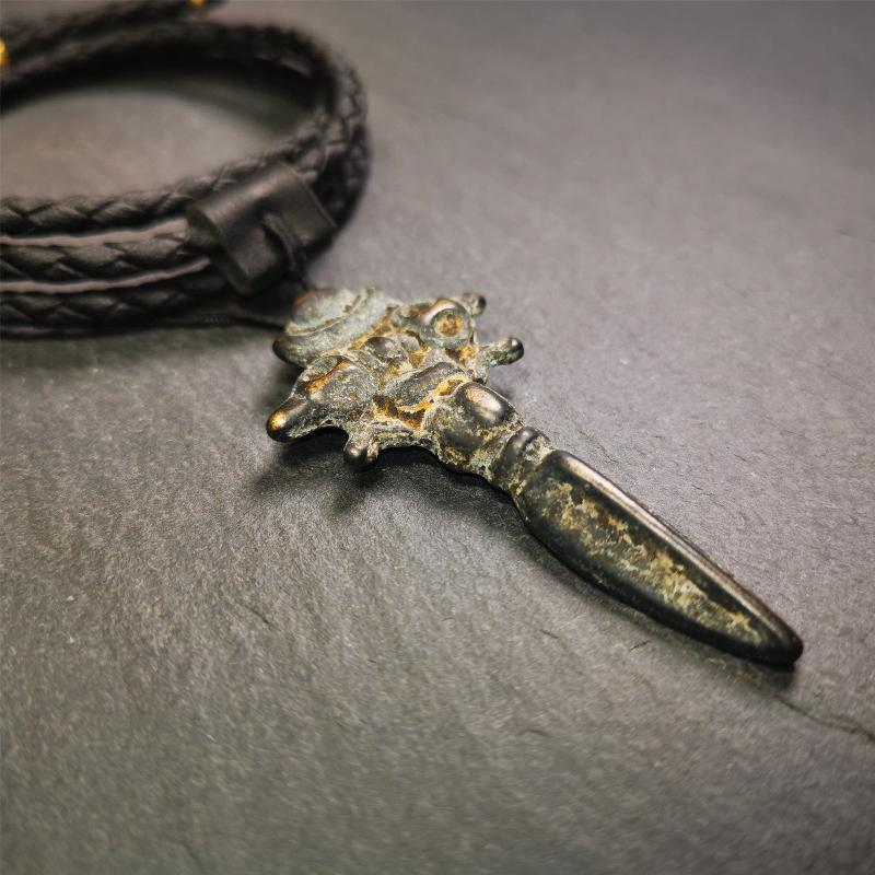 This beautiful phurba pendant was collected in Rejia Monastery,Baiyu,Tibet,about 70 years old.It was blessed by lama. It's made of thokcha, whole body is blcak,at the top is a mani jewel and horizontal vajra, the bottom is a vertical phurba