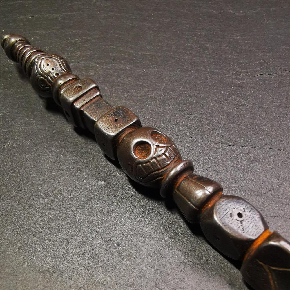 Gandhanra Tibetan Buddhist Ritual Implement - Kila -Dorje Phurba,Made of Cold Iron inlaid Copper,7.5".Its top is a stupa, in the middle is the skull Shmashana Adhipati, and at the bottom is a phurba,handmade by Tibetan craftsmen in 1990's.