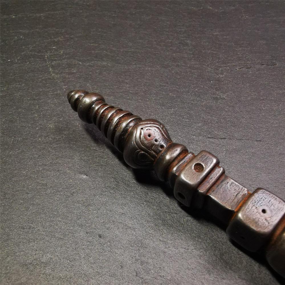 Gandhanra Tibetan Buddhist Ritual Implement - Kila -Dorje Phurba,Made of Cold Iron inlaid Copper,7.5".Its top is a stupa, in the middle is the skull Shmashana Adhipati, and at the bottom is a phurba,handmade by Tibetan craftsmen in 1990's.