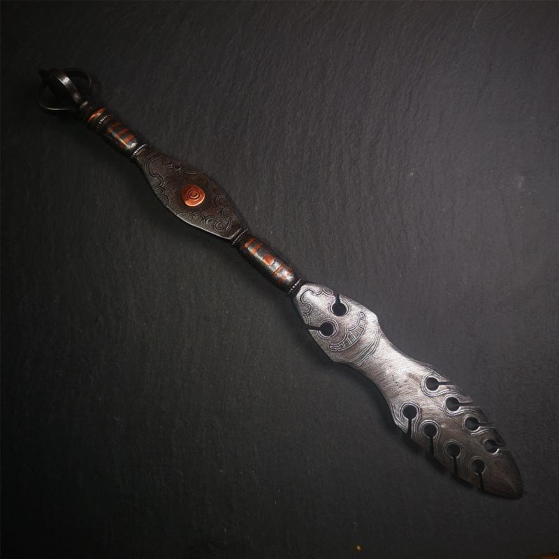 This vajra sword was handmade by Tibetan craftsmen from Tibet in 1990s,from Hepo Town, Baiyu County. It's a manjusri sword shape,flame shape blade,made of cold iron, carved conch pattern,and the vajra of the tail hanging ring