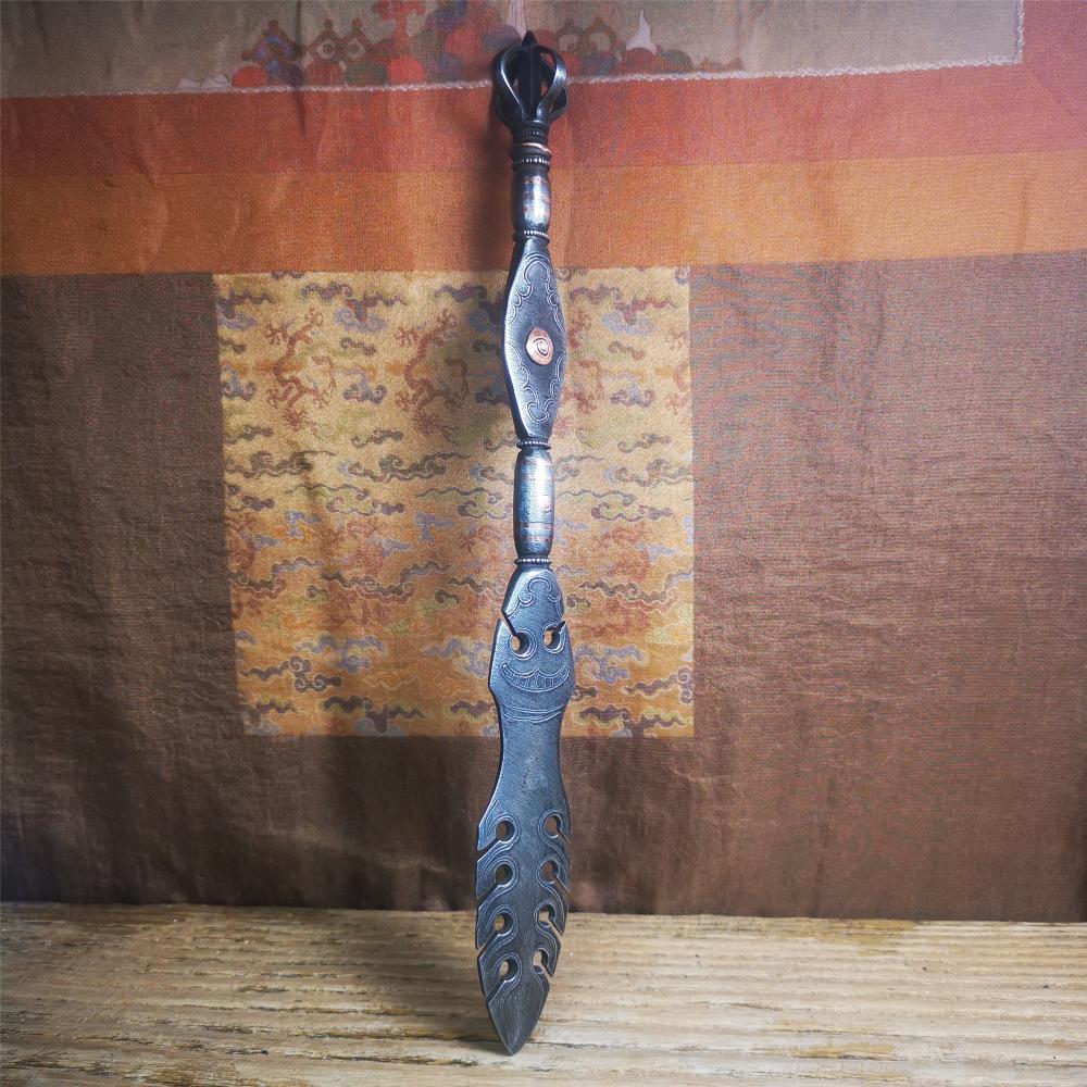 This vajra sword was handmade by Tibetan craftsmen from Tibet in 1990s,from Hepo Town, Baiyu County. It's a manjusri sword shape,flame shape blade,made of cold iron, carved conch pattern,and the vajra of the tail hanging ring