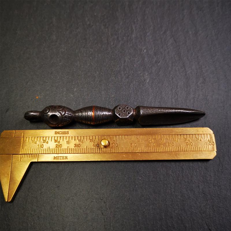 This phurba was made by Tibetan craftsmen and come from Hepo Town, Baiyu County, the birthplace of the famous Tibetan handicrafts. Its upper part is Shmashana Adhipati skull, the lower part is a Dorje Phurba,a dice in the middle,very delicate.