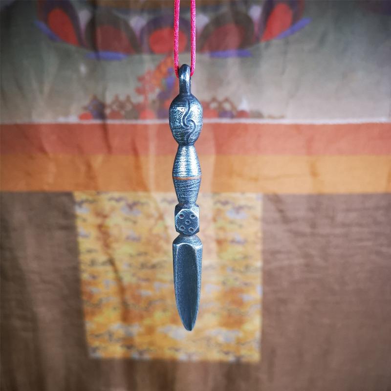 This phurba was made by Tibetan craftsmen and come from Hepo Town, Baiyu County, the birthplace of the famous Tibetan handicrafts. Its upper part is Shmashana Adhipati skull, the lower part is a Dorje Phurba,a dice in the middle,very delicate.