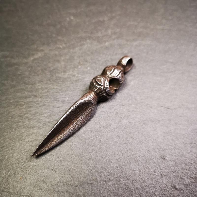 This phurba was made by Tibetan craftsmen and come from Hepo Town, Baiyu County, the birthplace of the famous Tibetan handicrafts. Its upper part is Shmashana Adhipati skull, the lower part is a Dorje Phurba