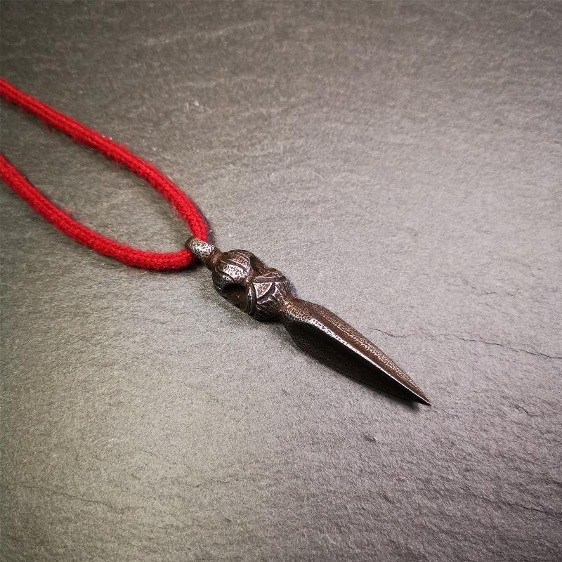 This phurba was made by Tibetan craftsmen and come from Hepo Town, Baiyu County, the birthplace of the famous Tibetan handicrafts. Its upper part is Shmashana Adhipati skull, the lower part is a Dorje Phurba