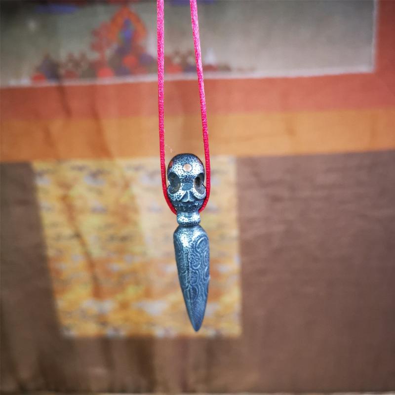 This phurba was made by Tibetan craftsmen and come from Hepo Town, Baiyu County, the birthplace of the famous Tibetan handicrafts. Its upper part is Shmashana Adhipati skull, the lower part is a Dorje Phurba, three copper dots inlaid on it