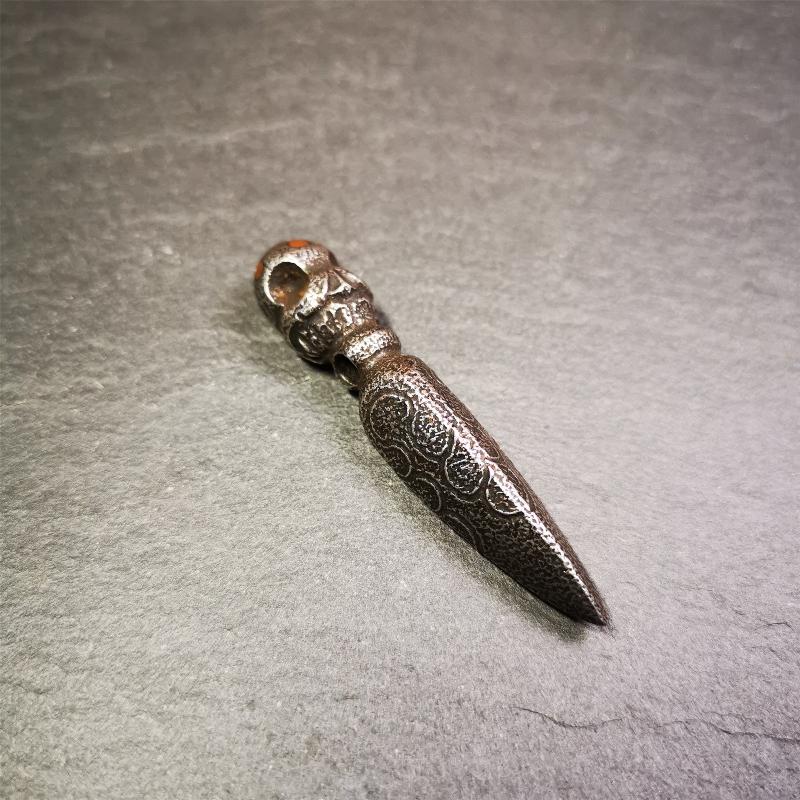 This phurba was made by Tibetan craftsmen and come from Hepo Town, Baiyu County, the birthplace of the famous Tibetan handicrafts. Its upper part is Shmashana Adhipati skull, the lower part is a Dorje Phurba, three copper dots inlaid on it