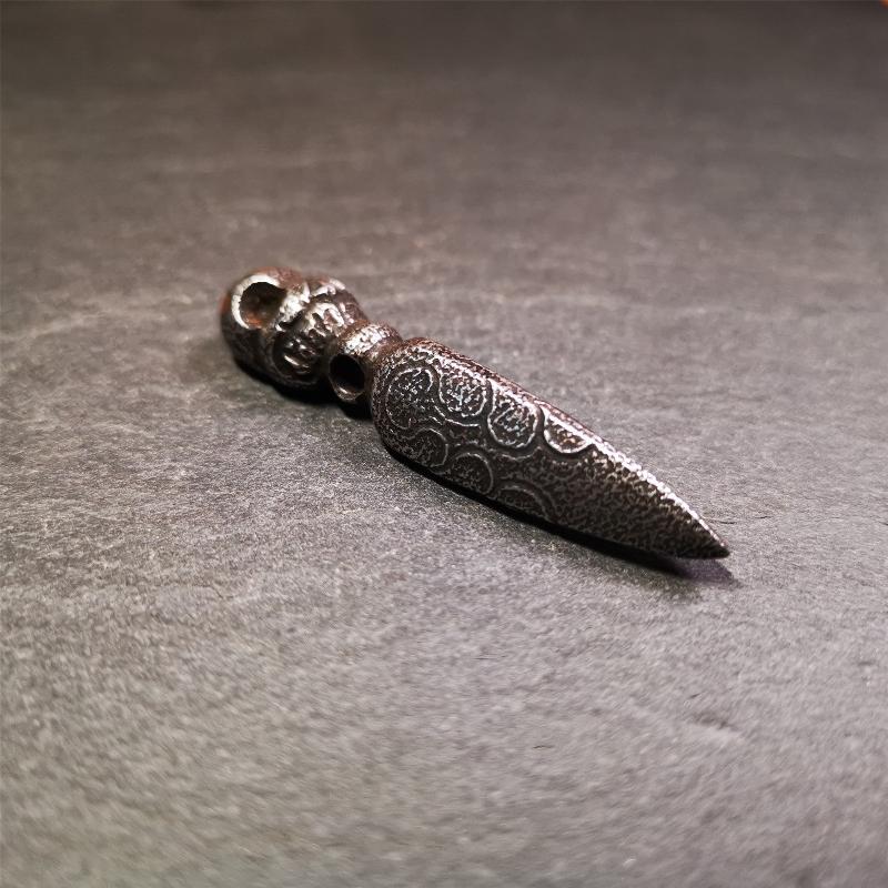 This phurba was made by Tibetan craftsmen and come from Hepo Town, Baiyu County, the birthplace of the famous Tibetan handicrafts. Its upper part is Shmashana Adhipati skull, the lower part is a Dorje Phurba, three copper dots inlaid on it