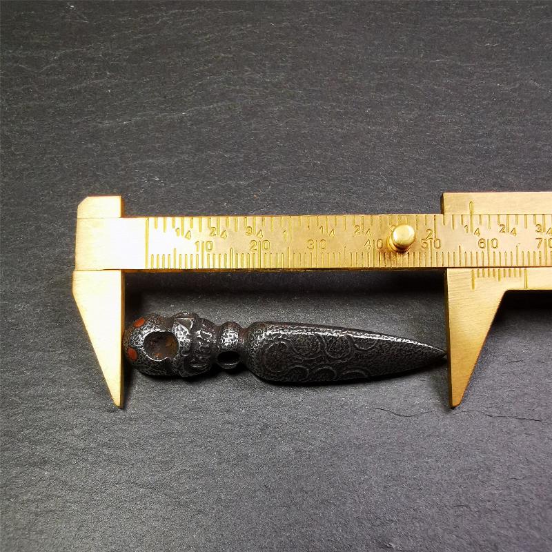 This phurba was made by Tibetan craftsmen and come from Hepo Town, Baiyu County, the birthplace of the famous Tibetan handicrafts. Its upper part is Shmashana Adhipati skull, the lower part is a Dorje Phurba, three copper dots inlaid on it