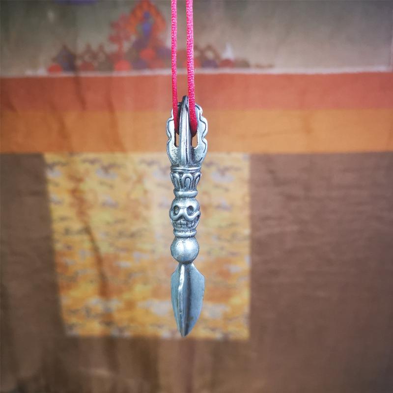 This phurba amulet was made of cold iron by Tibetan craftsmen in 1990's,its upper part is a vajra,and carved Shmashana Adhipati skull in the middle, the lower part is a Dorje Phurba,length is 3.0inches
