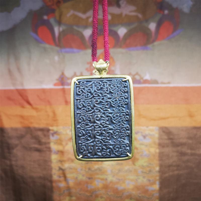 This badge is made by Tibetan craftsmen from Hepo Town, Baiyu County, the birthplace of the famous Tibetan handicrafts. It is made of thokcha, edging with copper, 2.76 × 1.77". The front is the OM mantra and the back is body, speech, and mind.