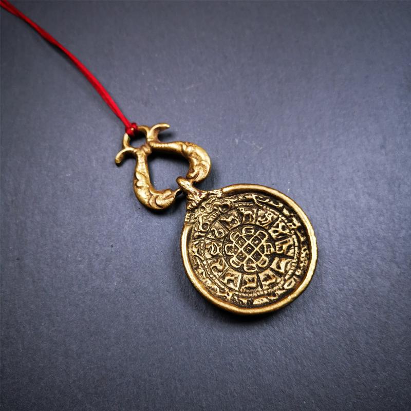 This Sipaho amulet was made by Tibetan craftsmen and come from Hepo Town, Baiyu County, Tibet. It is round shape,made of brass.Front pattern is Tibetan Budhist calendar symbol - SIPAHO(srid pa ho),the back is the gold fish and treasure vase symbol.