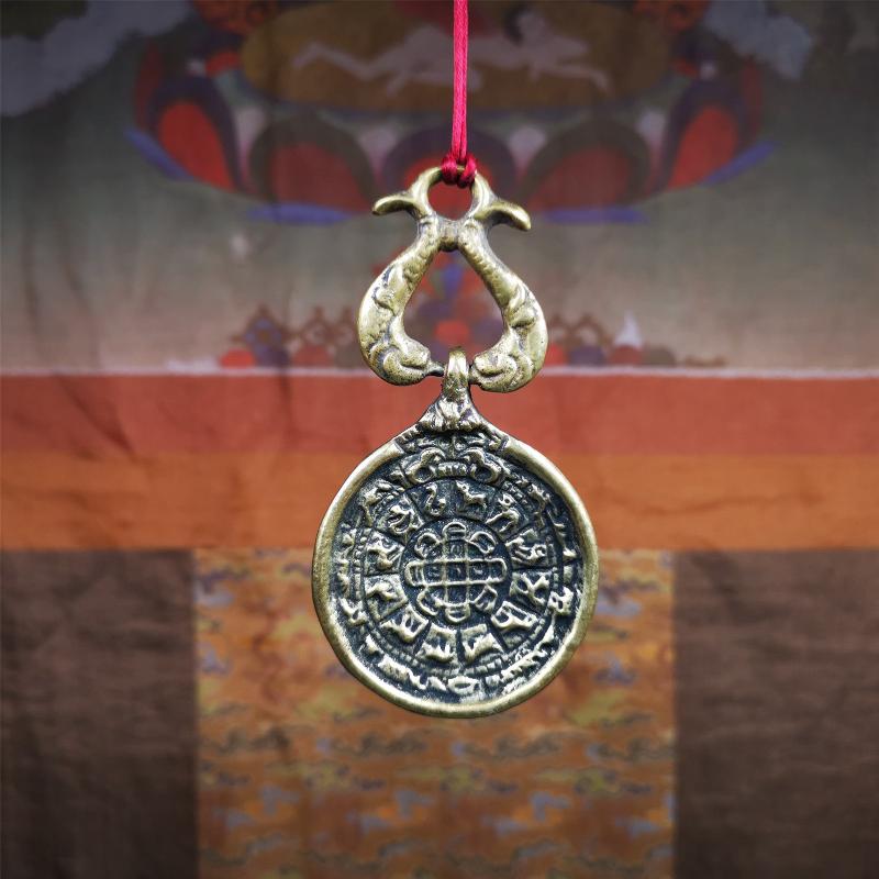 This Sipaho amulet was made by Tibetan craftsmen and come from Hepo Town, Baiyu County, Tibet.  It is round shape,made of brass.Front pattern is Tibetan Budhist calendar symbol - SIPAHO(srid pa ho),the back is the gold fish and treasure vase symbol.