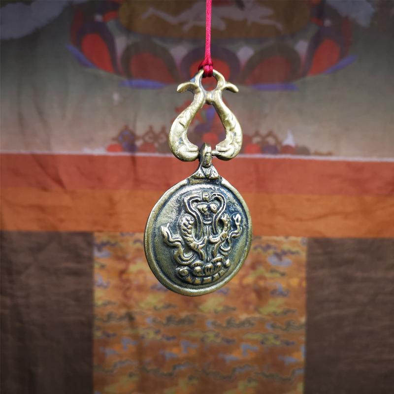 This Sipaho amulet was made by Tibetan craftsmen and come from Hepo Town, Baiyu County, Tibet. It is round shape,made of brass.Front pattern is Tibetan Budhist calendar symbol - SIPAHO(srid pa ho),the back is the gold fish and treasure vase symbol.