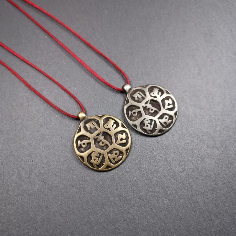 This om badge was made by Tibetan craftsmen and come from Hepo Town, Baiyu County, the birthplace of the famous Tibetan handicrafts. It is made of brass, 1.26 inches,carved with mantra of chenrezig OM MANI PADME HUM.