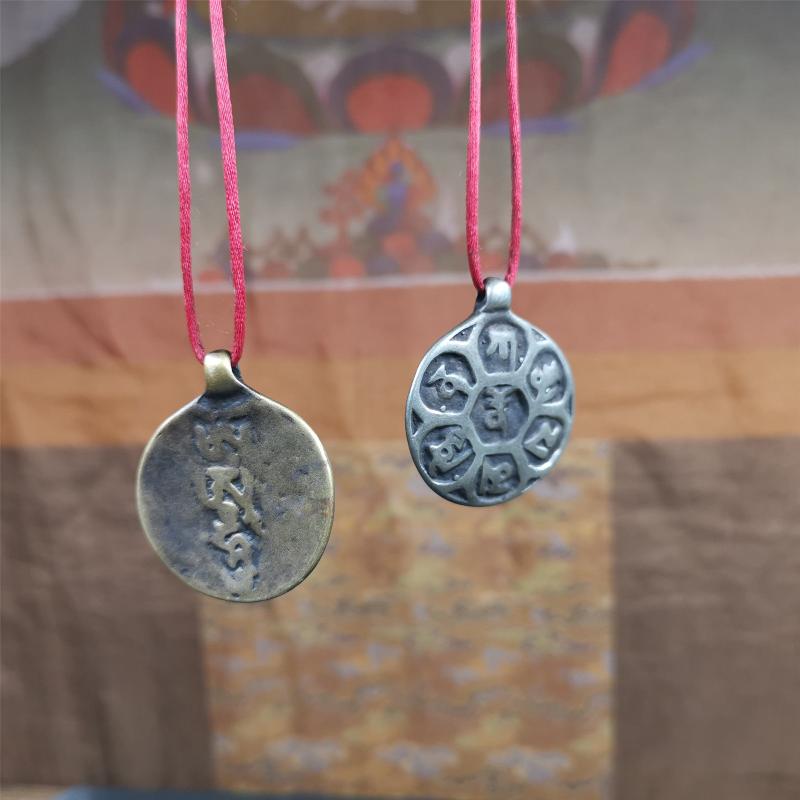 This om badge was made by Tibetan craftsmen and come from Hepo Town, Baiyu County, the birthplace of the famous Tibetan handicrafts. It is made of brass, 1.26 inches,carved with mantra of chenrezig OM MANI PADME HUM.