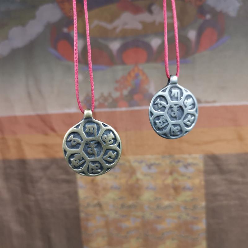 This om badge was made by Tibetan craftsmen and come from Hepo Town, Baiyu County, the birthplace of the famous Tibetan handicrafts. It is made of brass, 1.26 inches,carved with mantra of chenrezig OM MANI PADME HUM.