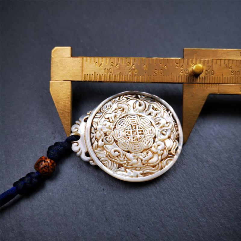 This unique Sipaho amulet was collected from Derge Parkhang Tibet about 80 years old. It was carved from shell,in different light and angles, it will emit unparalleled psychedelic colors.The front pattern is Tibetan Budhist calendar symbol - SIPAHO(srid pa ho),the back is cross vajra.