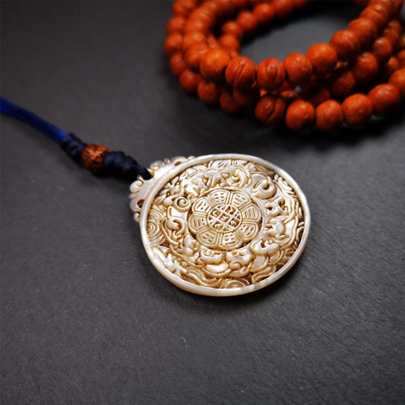This unique Sipaho amulet was collected from Derge Parkhang Tibet about 80 years old. It was carved from shell,in different light and angles, it will emit unparalleled psychedelic colors.The front pattern is Tibetan Budhist calendar symbol - SIPAHO(srid pa ho),the back is cross vajra.