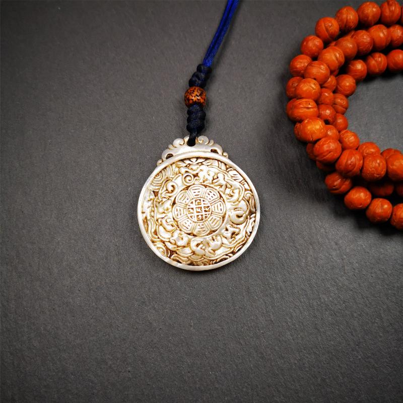 This unique Sipaho amulet was collected from Derge Parkhang Tibet about 80 years old. It was carved from shell,in different light and angles, it will emit unparalleled psychedelic colors.The front pattern is Tibetan Budhist calendar symbol - SIPAHO(srid pa ho),the back is cross vajra.
