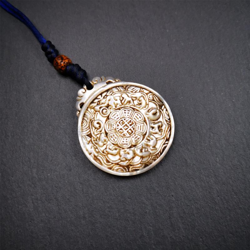 This unique Sipaho amulet was collected from Derge Parkhang Tibet about 80 years old. It was carved from shell,in different light and angles, it will emit unparalleled psychedelic colors.The front pattern is Tibetan Budhist calendar symbol - SIPAHO(srid pa ho),the back is cross vajra.
