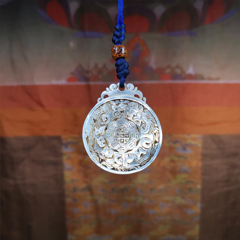This unique Sipaho amulet was collected from Derge Parkhang Tibet about 80 years old. It was carved from shell,in different light and angles, it will emit unparalleled psychedelic colors.The front pattern is Tibetan Budhist calendar symbol - SIPAHO(srid pa ho),the back is cross vajra.