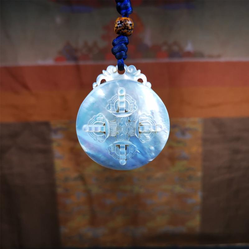This unique Sipaho amulet was collected from Derge Parkhang Tibet about 80 years old. It was carved from shell,in different light and angles, it will emit unparalleled psychedelic colors.The front pattern is Tibetan Budhist calendar symbol - SIPAHO(srid pa ho),the back is cross vajra.
