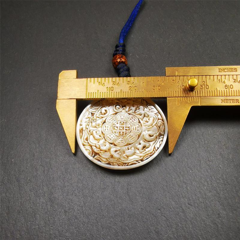 This unique Sipaho amulet was collected from Derge Parkhang Tibet about 80 years old. It was carved from shell,in different light and angles, it will emit unparalleled psychedelic colors.The front pattern is Tibetan Budhist calendar symbol - SIPAHO(srid pa ho),the back is cross vajra.