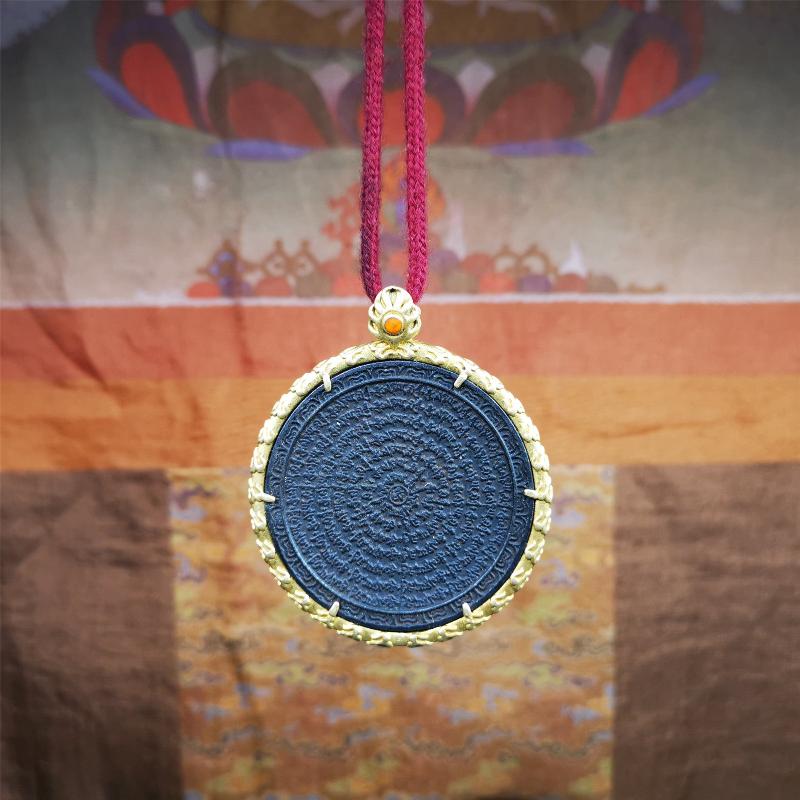 This badge is made by Tibetan craftsmen and come from Hepo Town, Baiyu County,Tibet. It is made of thokcha, edging with copper,round shape, 2.52 inche diameter. The OM MANI PADME HUM mantra arranged in concentric circles.