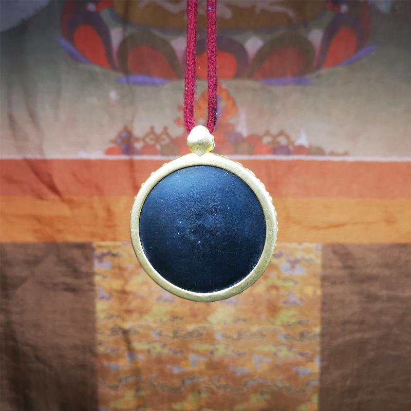 This badge is made by Tibetan craftsmen and come from Hepo Town, Baiyu County,Tibet. It is made of thokcha, edging with copper,round shape, 2.52 inche diameter. The OM MANI PADME HUM mantra arranged in concentric circles.
